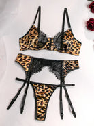 Flat lay of leopard lace bra, thong, and garter belt set
