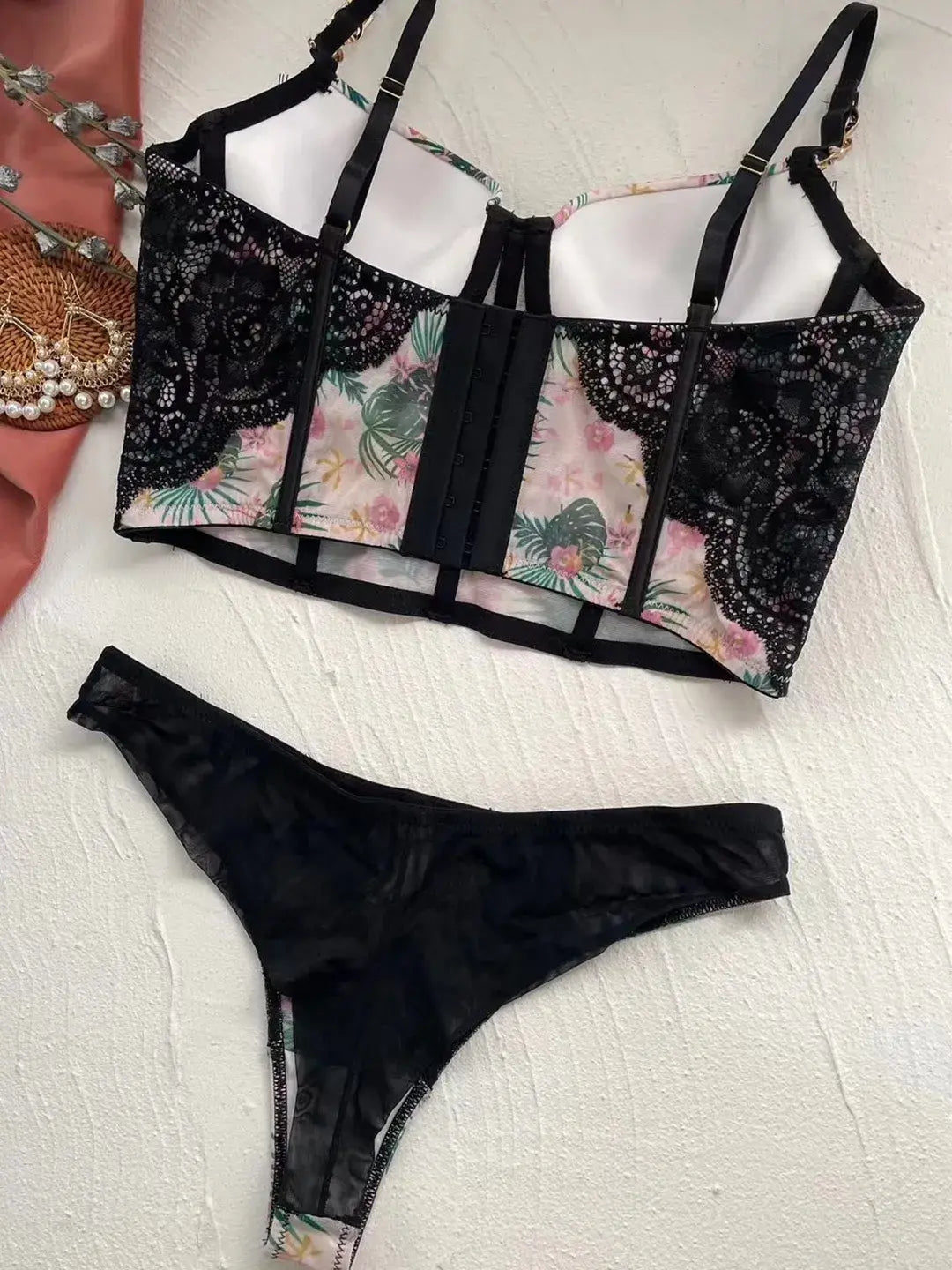 Back flat lay of Moonlight Petal lingerie bodysuit, showcasing sheer mesh and soft corset construction.