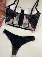 Back flat lay of Moonlight Petal lingerie bodysuit, showcasing sheer mesh and soft corset construction.