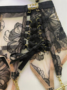 Layflat view of Noir Eclipse garter belt and thigh straps set with gold hardware, complete lingerie accessory for boudoir