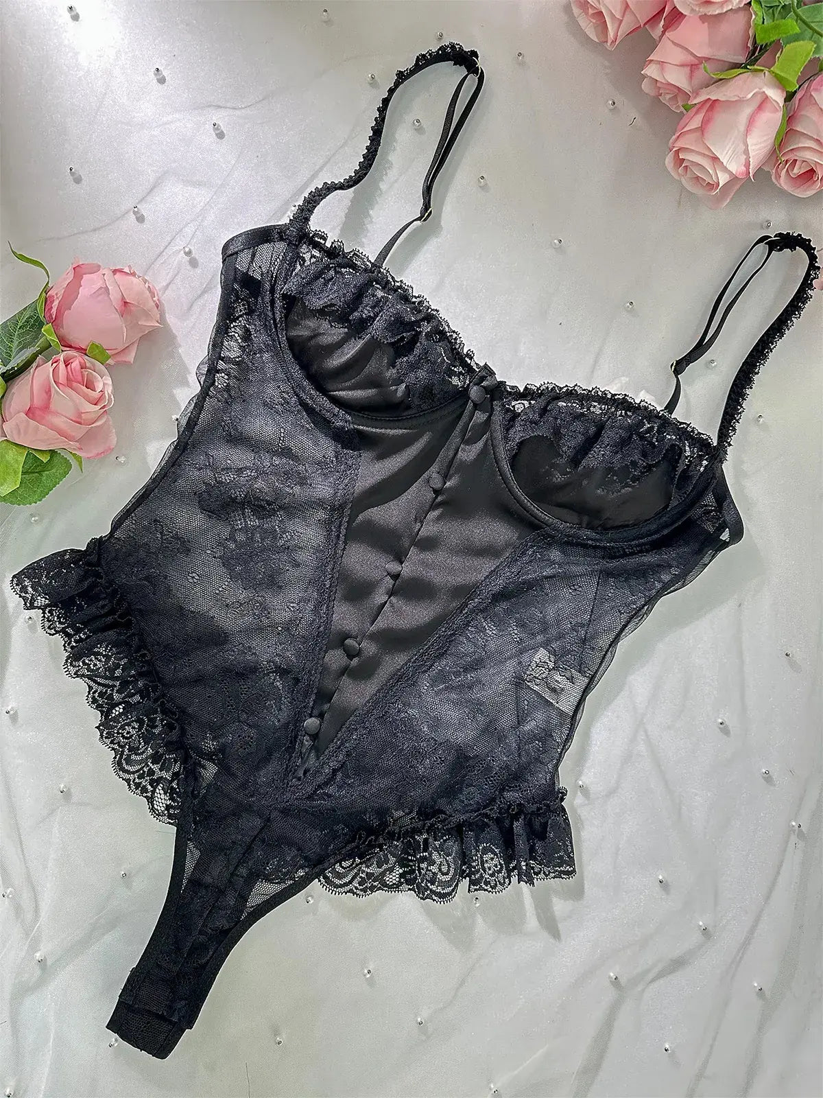 Layflat image showcasing fabric texture and lace patterns of Noir Lace Bodysuit Teddy.