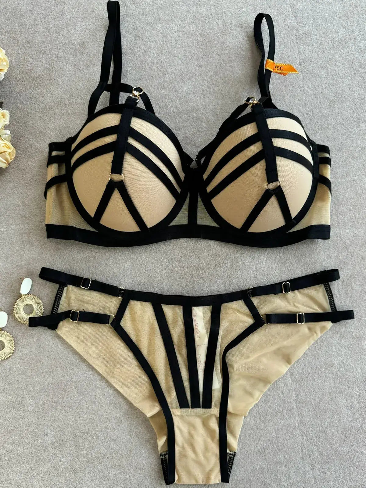 Full view of nude bra and thong set showing structure and balanced design