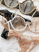 Detailed close-up of sheer mesh and lace in Nude Lace Women Underwear Set and Black Gold corset set.