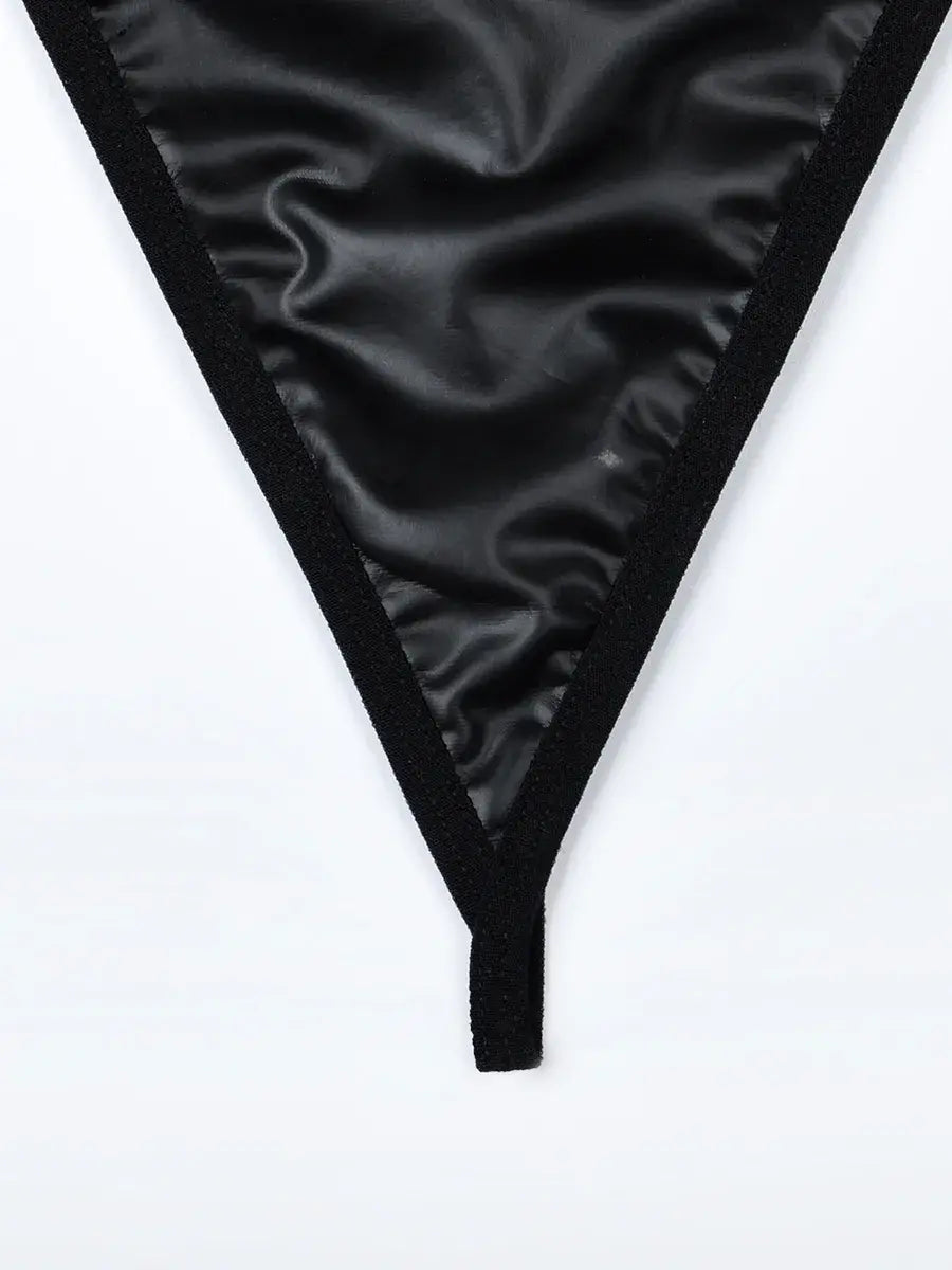 Comfortable black PU thong with soft lining and flattering fit, designed for both elegance and wearability in the Obsidian Edge set.