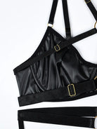 Rich layering of black elastic straps with gold metal link accents, adding bold structure to the Obsidian Edge lingerie set.