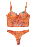 Flat lay of Orange Blossom embroidered lace bra, showcasing floral details and soft corset lines.