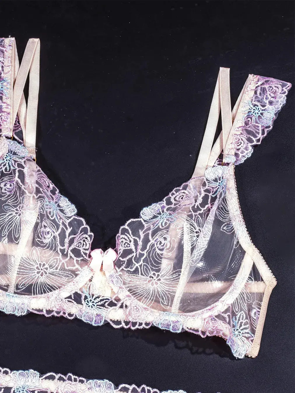 Purple lace cami with delicate embroidery and matching bra.