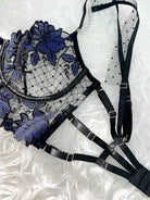 Extreme close-up of sapphire blue sheer lace bra with floral embroidery and underwire support, luxury lingerie craftsmanship
