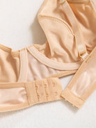 Close-up of precision stitching on the nude PU bodysuit, highlighting minimalist craftsmanship and luxury.